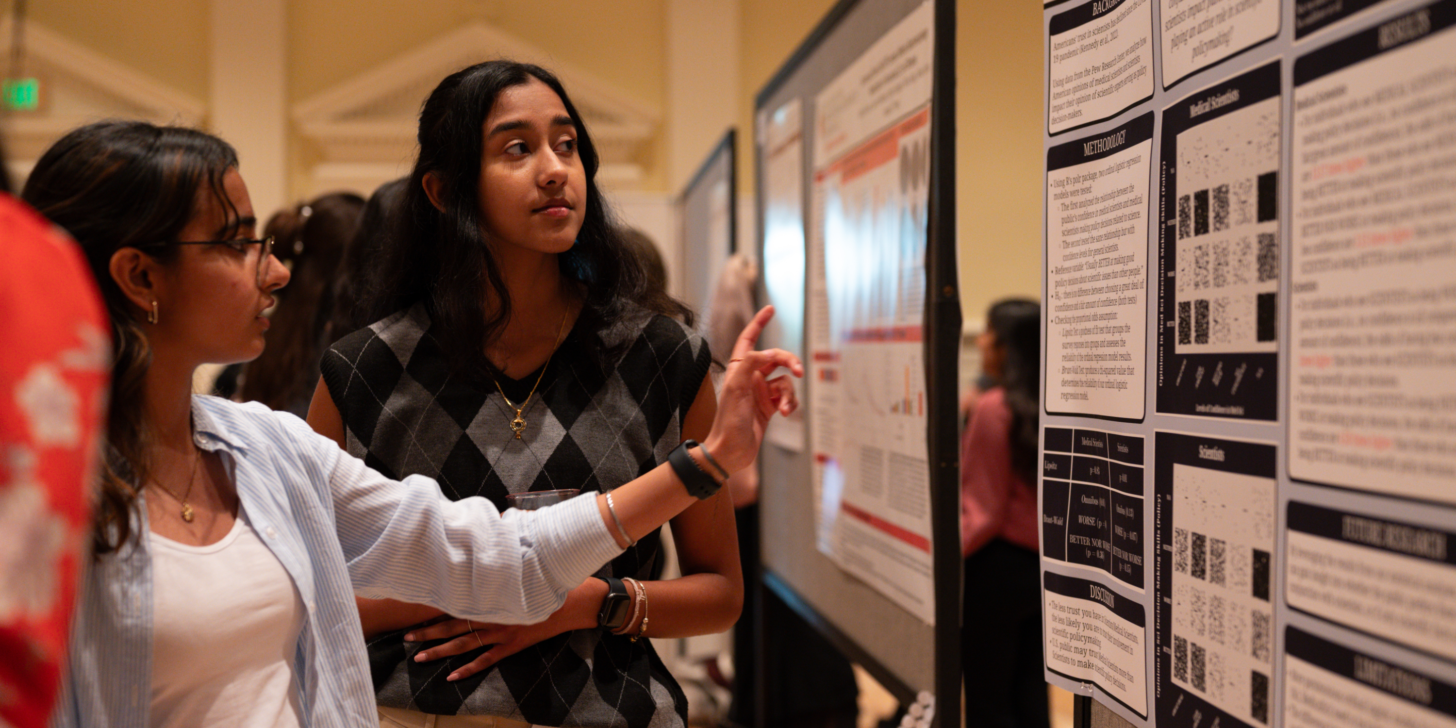 students in front of a poster