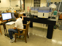 Person at desk working with equipment