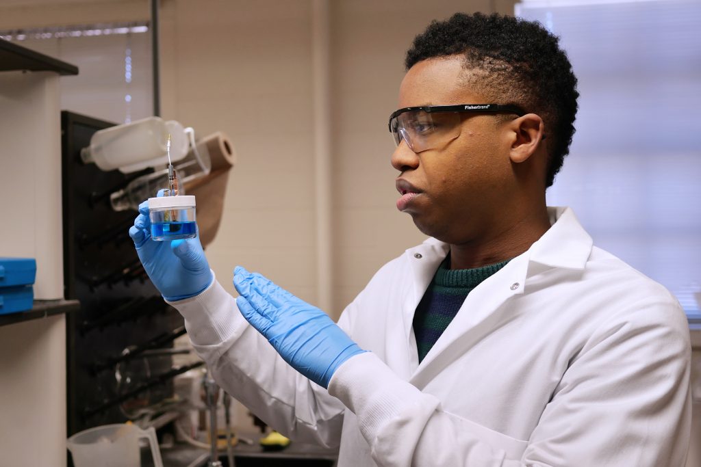 Hakeem Henry working in a lab. 