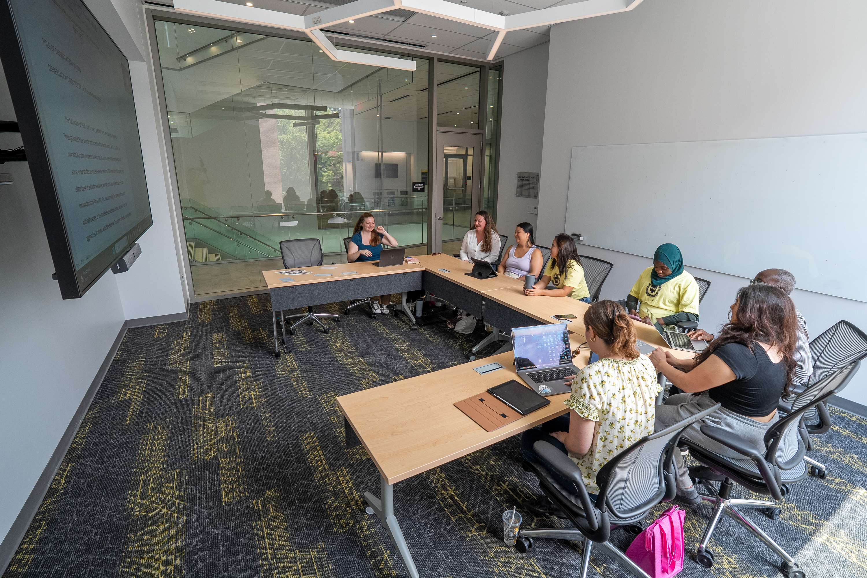 lab group meeting in the Mike and Jan Doyle Seminar Room