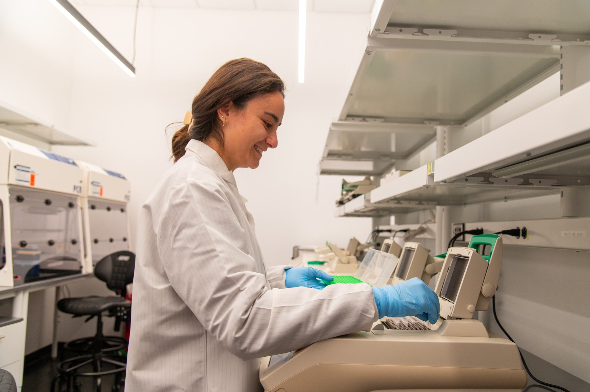 Clara Abdelmalek prepares and loads samples for PCR amplification to help identify genetic material.