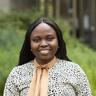 image of Esther Olonimoyo smiling 