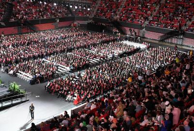 Commencement at the Xfinity Center. A high view of the huge crowd of students and guest.