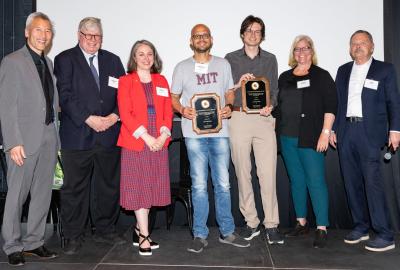 Pratyush Tiwary (center) and Lukas Herron receive the Life Sciences Invention of the Year Award. Photo by Mike Morgan