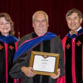 Jeffery Davis receiving his award